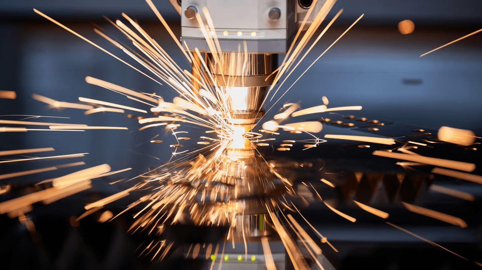 laser cutting sheet metal with flying sparks